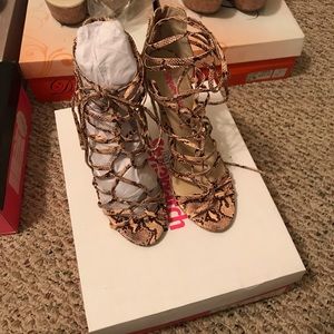 Women’s strappy snake skin heels